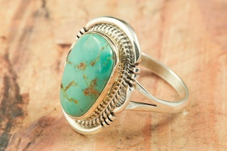 Genuine Pilot Mountain Turquoise set in Sterling Silver Ring. The Pilot Mountain Mine is located in Esmeralda County, Nevada. Created by Navajo Artist John Nelson. Signed by the artist.